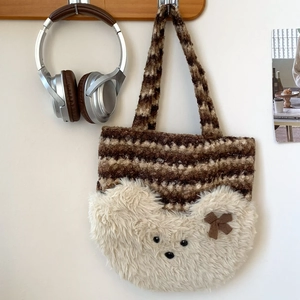 Close-up of soft brown striped plush tote bag featuring a cute white fluffy bear face detail