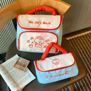 Two-piece puppy makeup bag set with blue patchwork, red handles, and cute embroidery