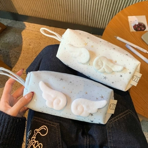 Detail of star pattern pencil case with plush wings and convenient side handle