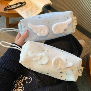 Close-up of star pattern stationery bags with plush wings and portable handles