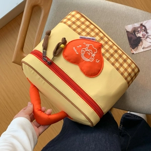 Detail of insulated lunch bag with orange heart embroidery and thick sponge handle