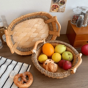 Set of natural rattan woven fruit baskets with wooden handles for home table storage