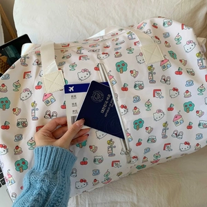 Detail of Hello Kitty travel bag showing the exterior zipper pocket for passport and tickets