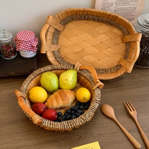 Detail of hand-woven wood chip tray with twine edges and practical carry handles