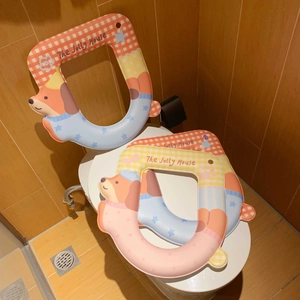 Detail of waterproof EVA toilet seat covers with cute dog design and convenient handles