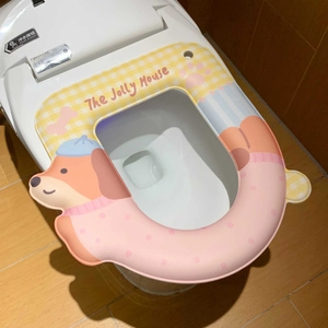 Macro detail of waterproof thickened toilet seat cover with cartoon dog pattern