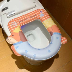 Detail of thickened waterproof toilet seat cover with cartoon dog and soft sponge padding