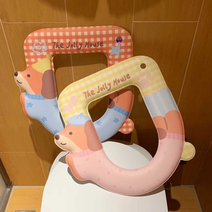 Detail of waterproof U-shaped toilet seat pads with cute cartoon dachshund pattern