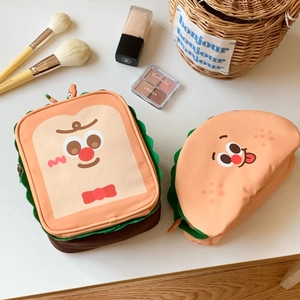 Detail of cute toast and sandwich makeup bags with compartments for travel storage
