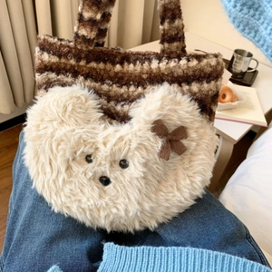 Detailed close-up of a cute plush puppy tote bag featuring soft brown knit and cream faux fur