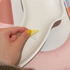 Detail showing adhesive backing application for waterproof toilet seat cover cushion