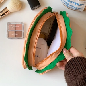 Detailed interior of a hamburger-style makeup bag showing spacious storage for cosmetics