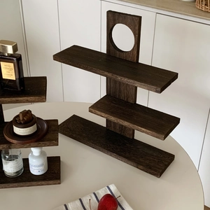 Detail of multi-layer solid wood display shelf with natural grain and tiered structure
