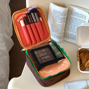 Cute toast makeup bag with internal compartments for brushes and travel essentials
