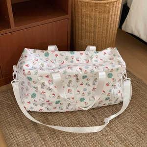 Detail of Hello Kitty pattern travel bag with adjustable strap and dual handles