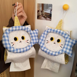 Detail of cute embroidered cat face on a hanging checkered fabric tissue pouch holder