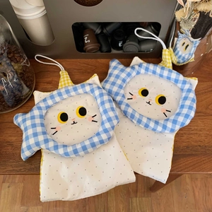 Detail of two cute cat-shaped fabric tissue pouches with blue gingham fish accents and lanyards