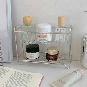 Close-up of a 2-tier silver wire mesh desktop organizer with sleek side handles
