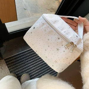 Portable white star-patterned makeup bag with handle and dual zipper for travel storage