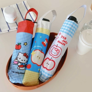 Three foldable sun umbrellas with Hello Kitty cases and wrist straps in a woven tray