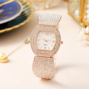 Luxury rose gold tonneau watch with sparkling rhinestones and crystal-set strap