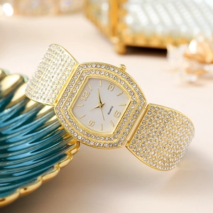 Luxury gold tonneau women's watch with full crystal pavé bezel and quartz movement