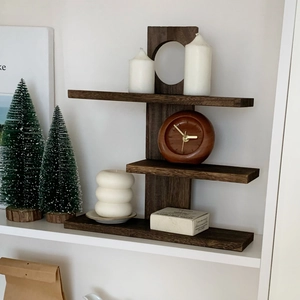Detailed close-up of dark walnut 3-tier wall shelf showing natural wood grain texture