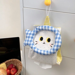 Detail of hanging cat tissue holder with blue checkered ring and embroidered cat face