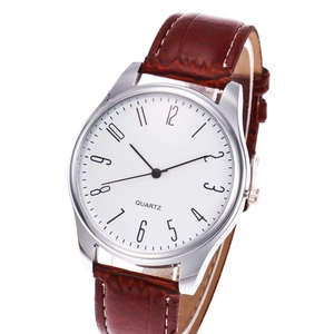 Detailed 45-degree angle of a men's quartz watch with brown leather embossed strap