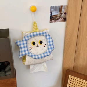 Hanging cute cat tissue box holder with blue plaid fish border in a home setting