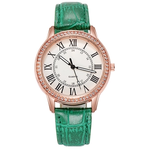 Women's quartz watch with green leather strap, rose gold case, and rhinestone bezel