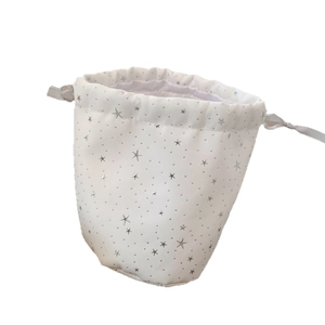 Portable white drawstring cosmetic bag with silver star patterns for makeup storage