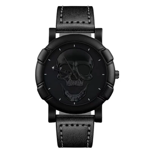 Hip-hop style all-black watch featuring a matte skull dial and white-stitched leather band