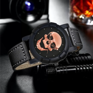 Close-up of a punk-style skull watch dial with high-quality black leather strap detail
