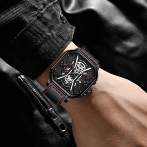 Detailed close-up of a square men's quartz watch featuring a black embossed dial and red stitching