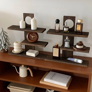 Detail of vintage tiered walnut wood shelf with unique circular hollow decorative pillars