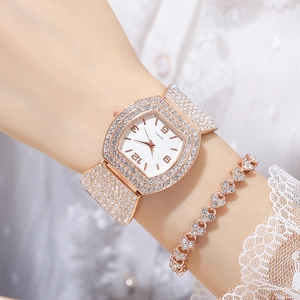 Luxury rose gold tonneau watch with full diamond setting and matching heart bracelet
