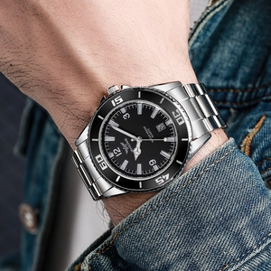 Men's quartz watch with silver steel band, black dial and calendar display on wrist