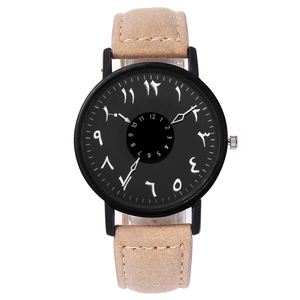 Detail of quartz watch with Eastern Arabic numeral dial and sand suede leather strap