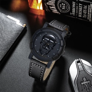 Macro view of a 3D skull dial men's watch with leather strap and white stitching