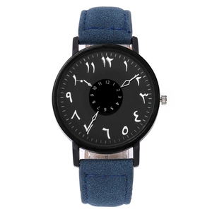 Detail of black dial with dual numeric scales and blue frosted leather strap on quartz watch