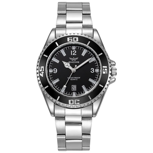 Close-up of quartz watch dial with date magnifier and rotating black diving bezel
