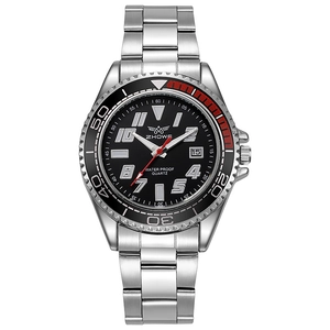 Close-up of quartz watch with red and black rotating bezel and date display window