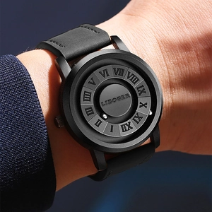 Macro detail of minimalist black magnetic ball watch with 3D Roman numeral markers