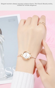 Elegante SKMEI Damen-Quarzuhr aus Gold mit schmalem Stahlband und Kristallring-Set