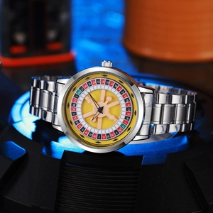 Macro view of rotating roulette dial and steel casing on this creative men's watch