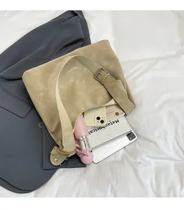 Interior view of large beige tote bag showing high capacity for tablets and umbrellas