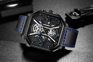 Macro shot of square men's quartz watch with blue stitching and industrial dial detail