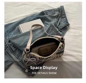 Detail view showing spacious interior of the floral print canvas bag with wallet inside