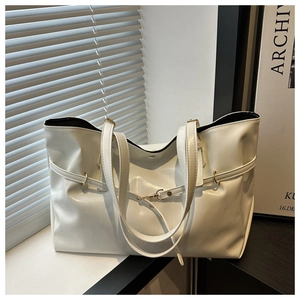 Detailed view of white high-shine PU leather tote bag with elegant buckle and strap